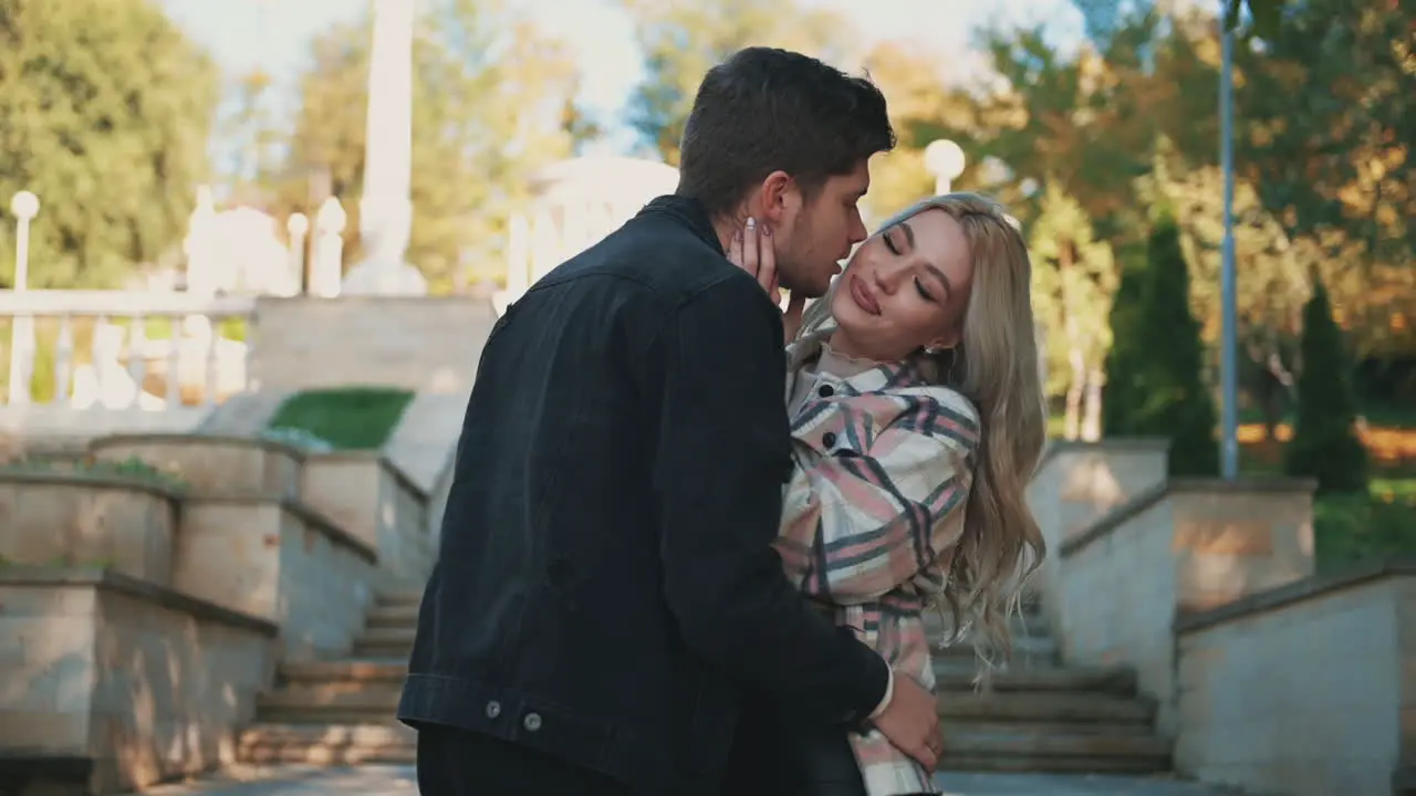 Romantic Man Kisses Woman On The Cheek