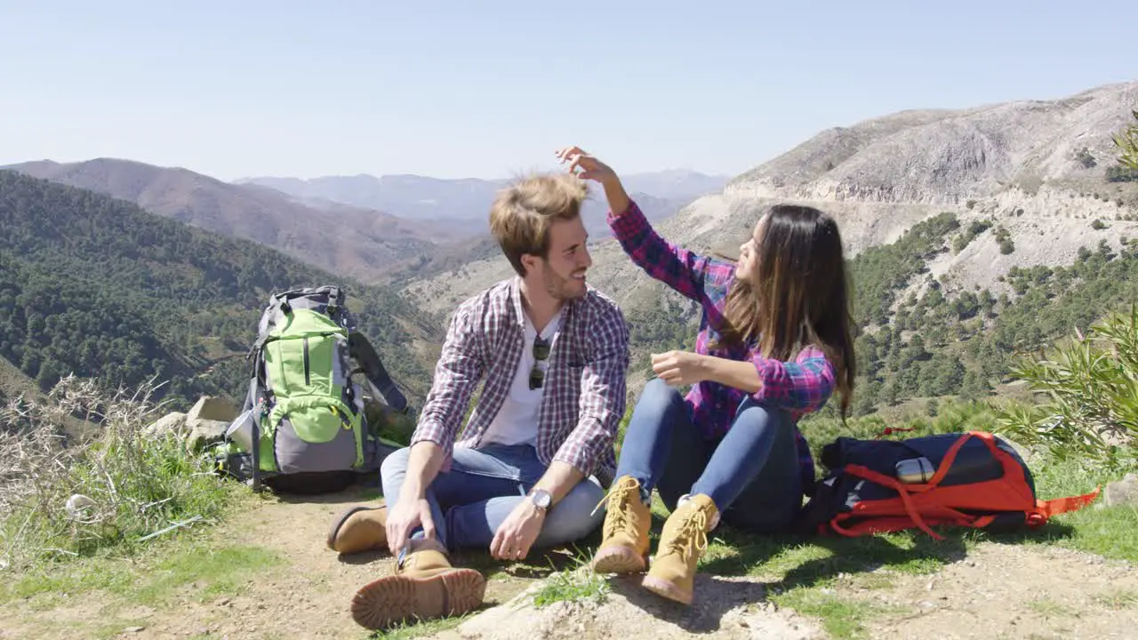 Two people taking rest while hiking