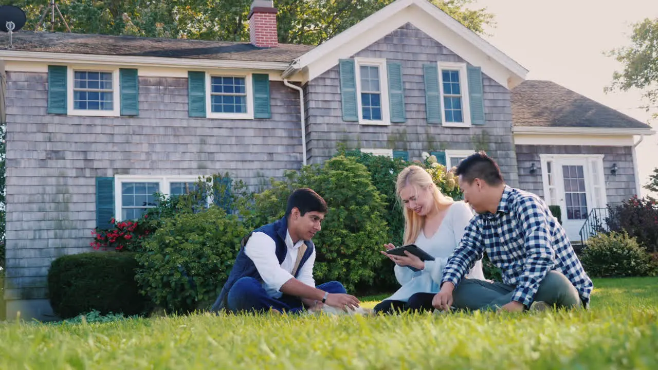 Friends Relaxing in Yard With Tablet