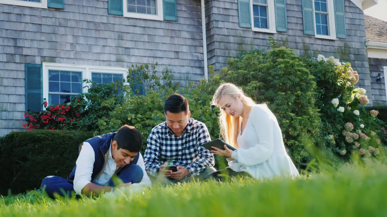 Friends Use Phone and Tablet With Dog