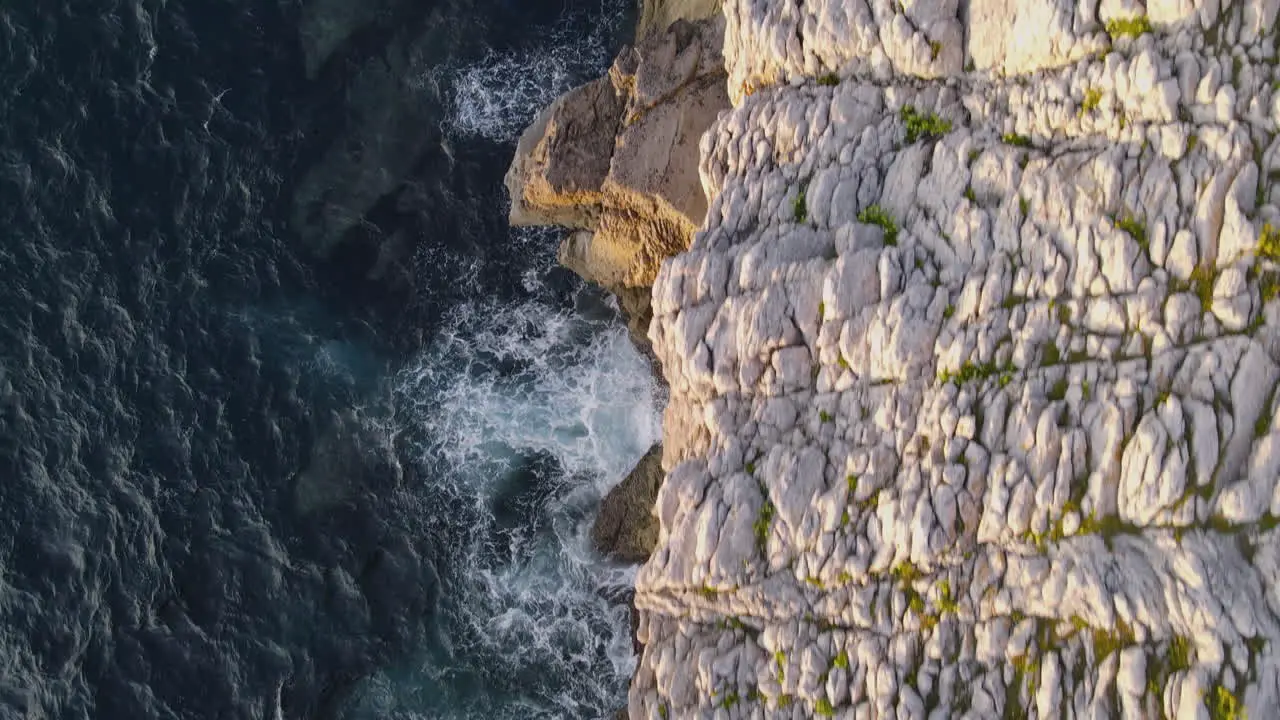 Close Up Of Sea Waves Breaking On Rocky Shore