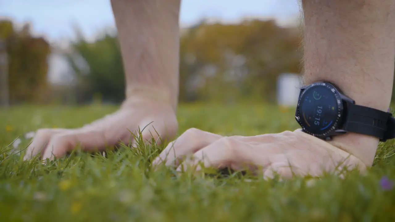 Close-up shot of an athletic man setting his