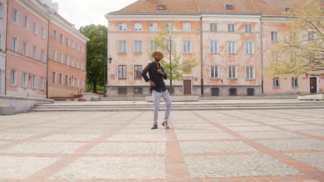 Afro Caribbean Man Dancing Alone In A Public Square