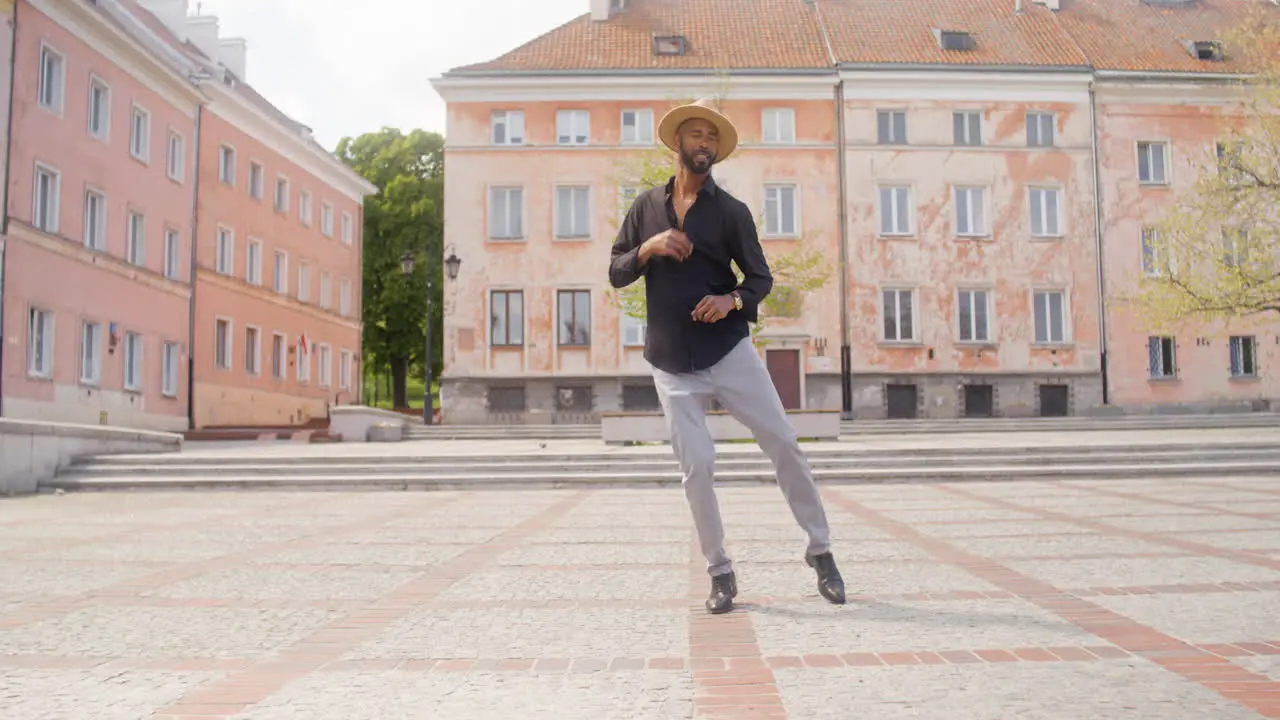 Afro Caribbean Man Dancing Alone In A Public Square 1