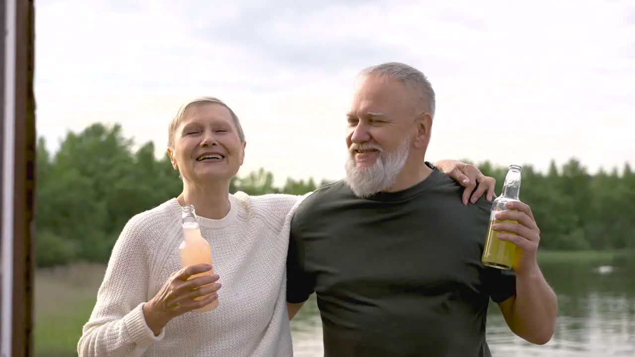 A Couple Of Senior Friends Dancing And Having A Drink