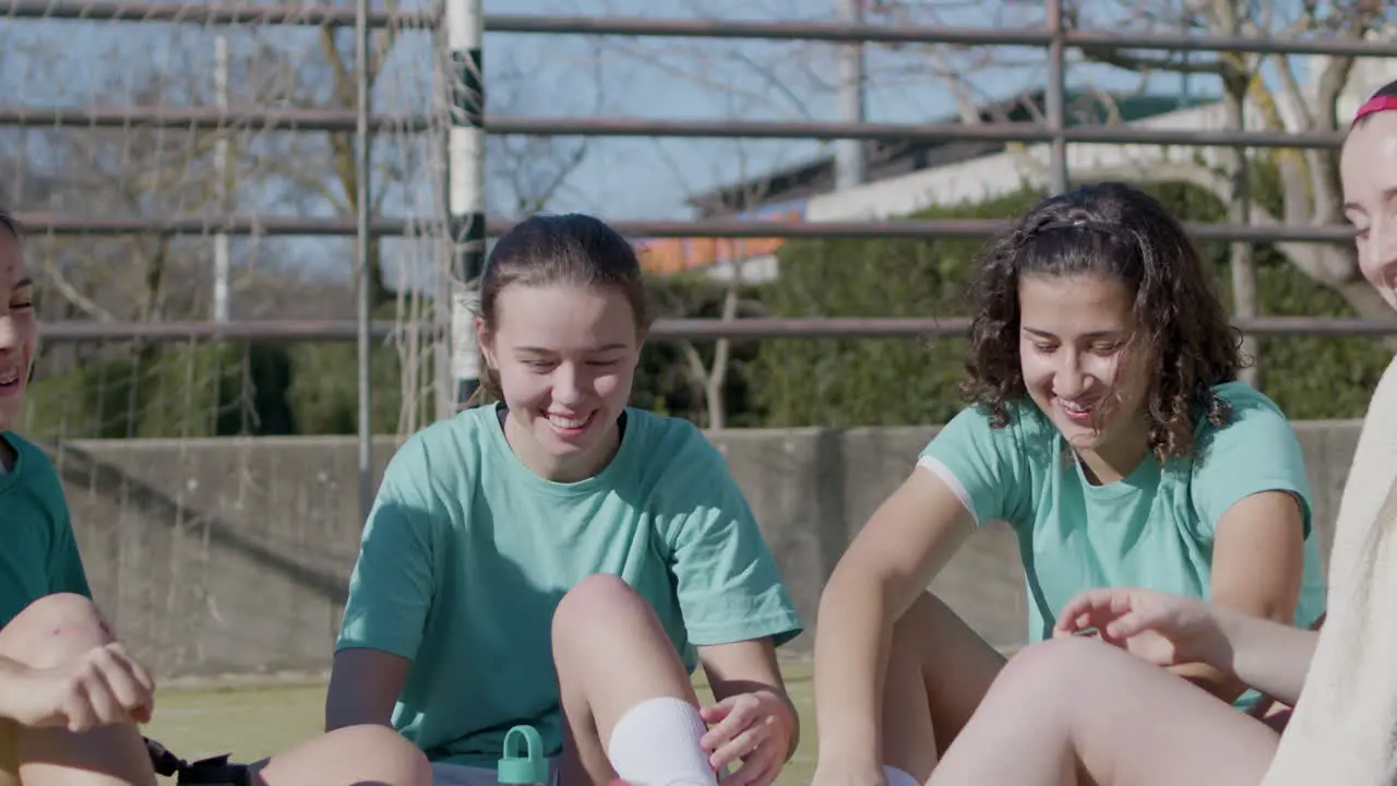 Sporty Happy Teenager Girls Having Rest After Successful Training