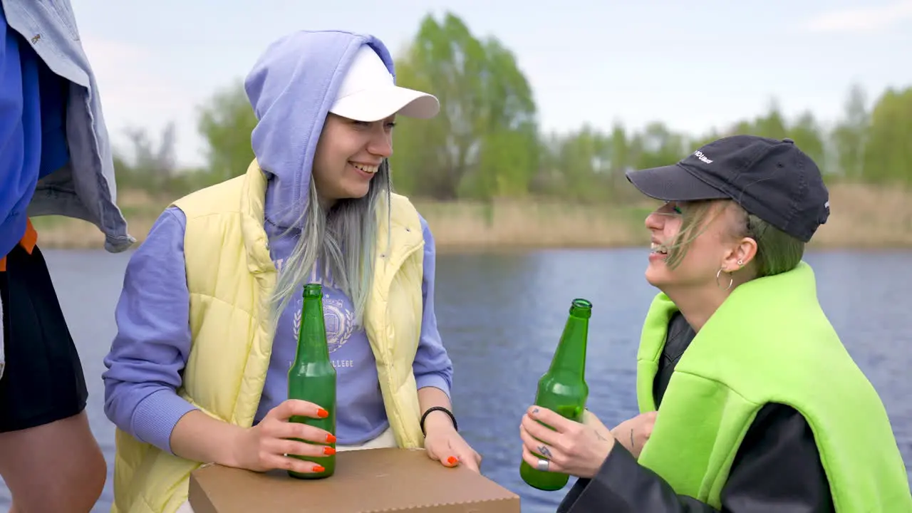 Young Friends Having Fun Outdoors Drinking Beer