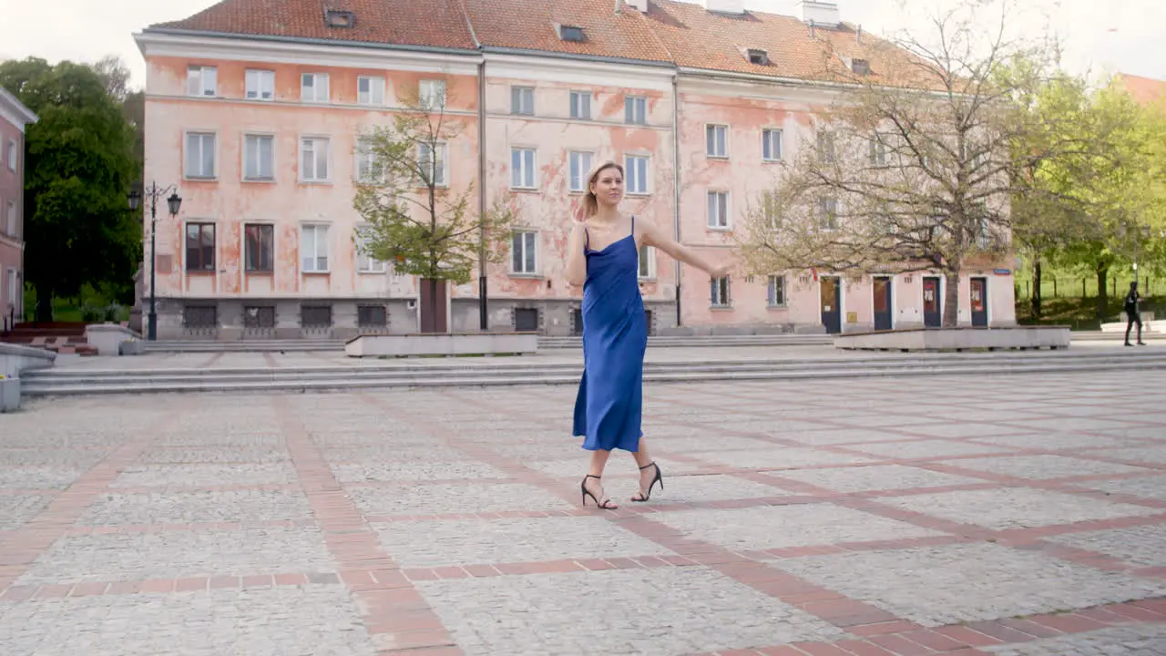 Beautiful Woman Dancing Alone In A Public Square