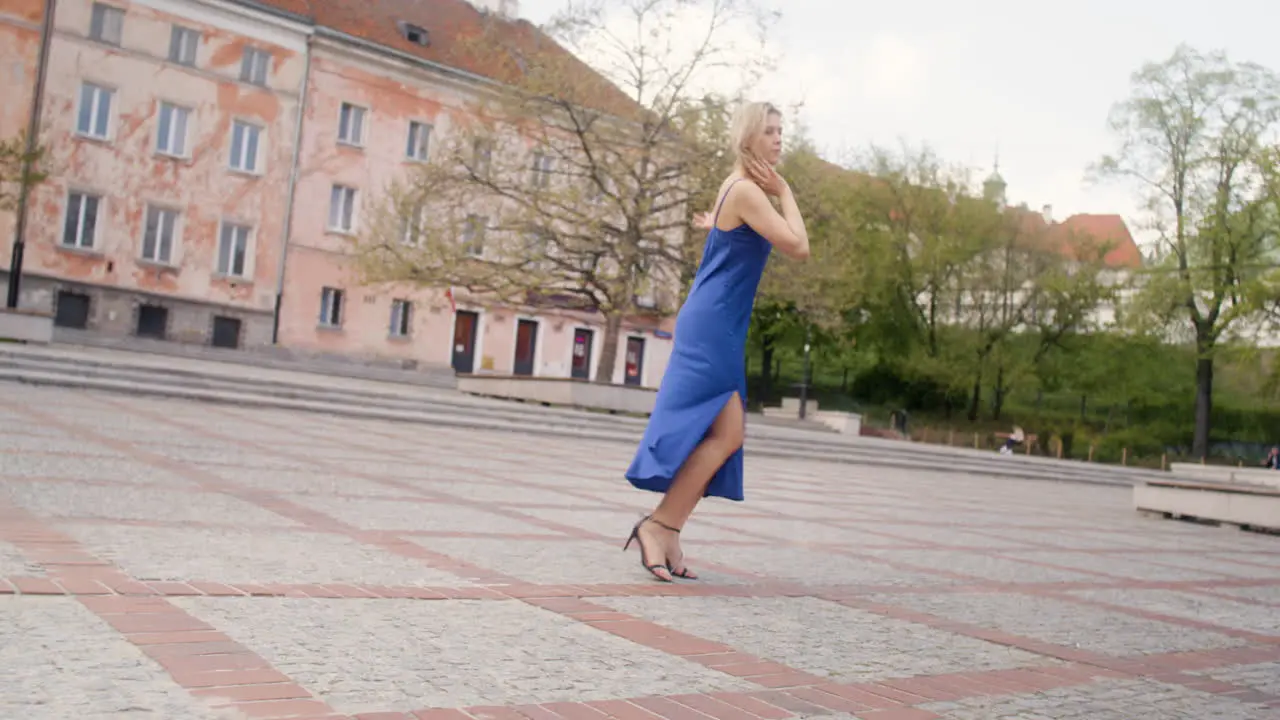 Beautiful Woman Dancing Alone In A Public Square 4