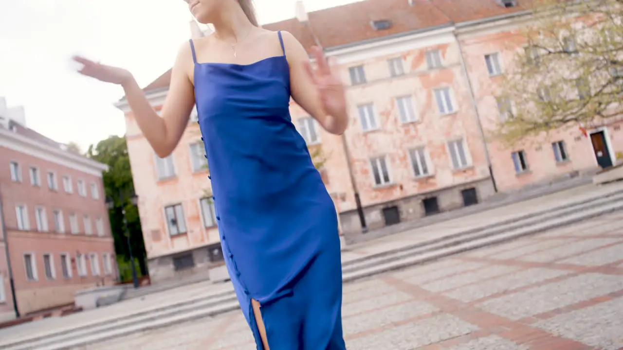 Happy Woman Dancing Alone In A Public Square 1