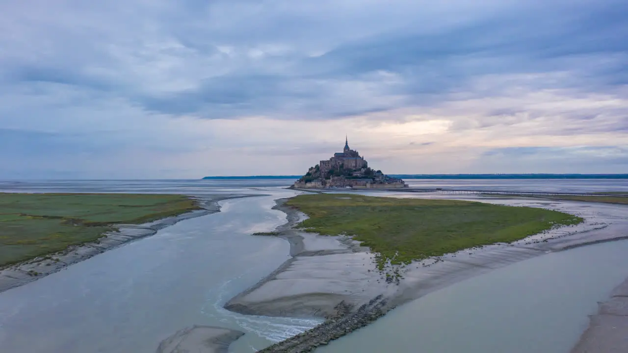 Le Mont Saint Michel France Castle in Ocean Sunrise Night to Day Hyperlapse Aerial forward