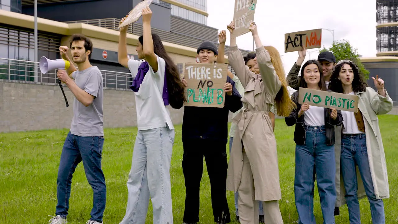 Group Of People In A Protest With Megaphones And Placards 2