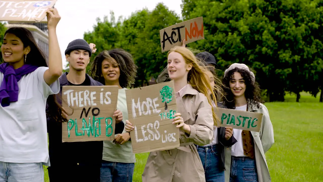 Group Of People In A Protest With Megaphones And Placards 1