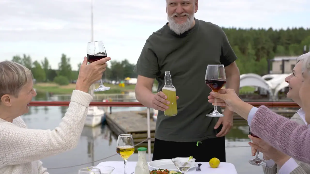 A Group Of Senior People Toasting