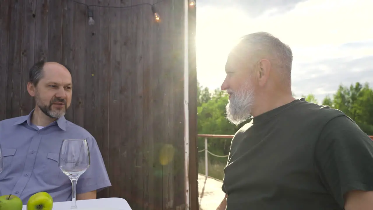 Two Senior Men Having A Drink