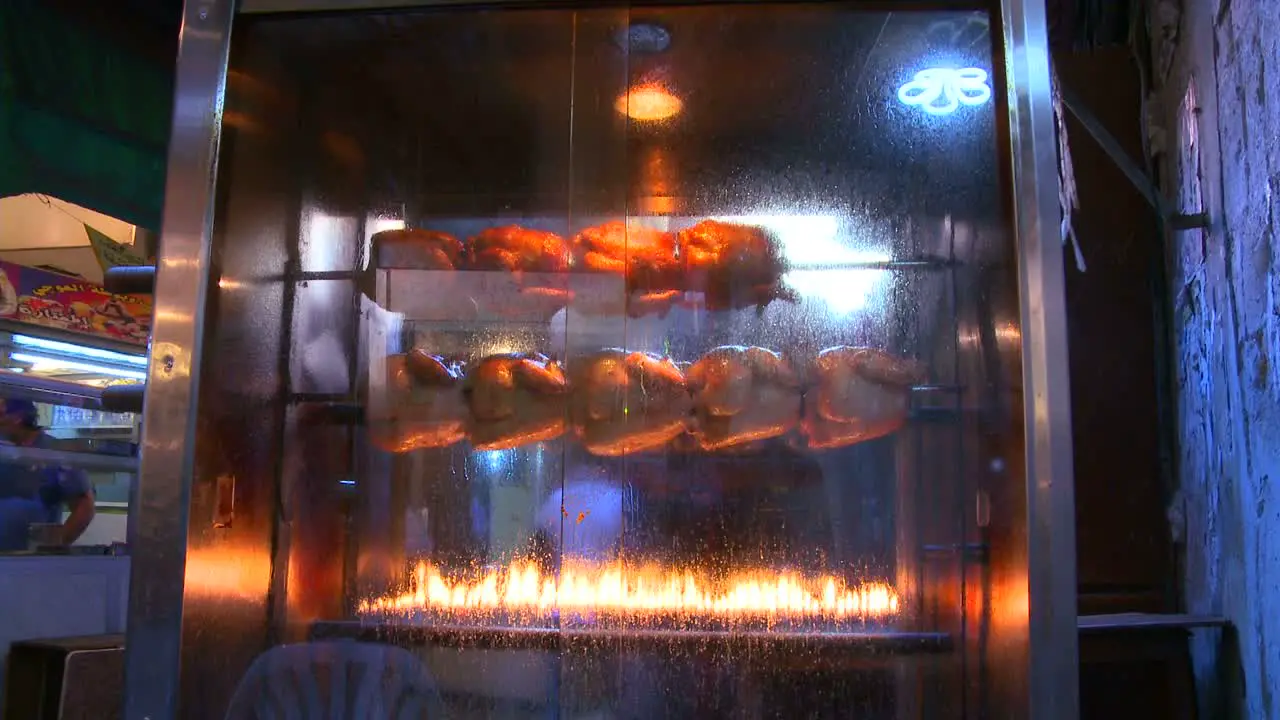 Chickens roast on an open spit in the Arab market in the Hezbollah city of Sidon in Southern Lebanon