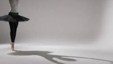 Wide Shot of Ballet Dancers Feet on Pointe with Copy Space