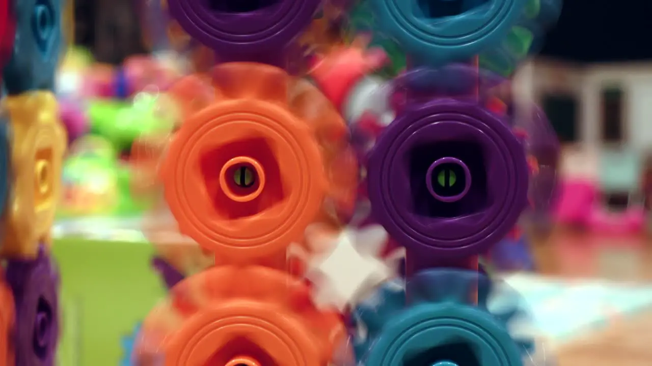 Kids Toy Colored spinning gears close up