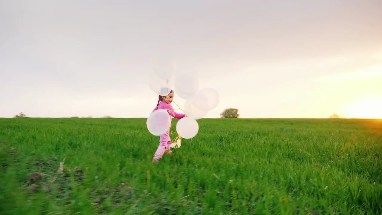 Little Girl In Pink Clothes With Balloons 2