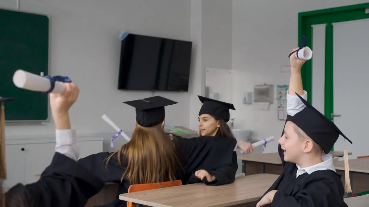 Two Happy Students Hugging In Class