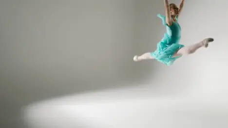 Wide Shot of Young Ballet Dancer Dancing Around Room