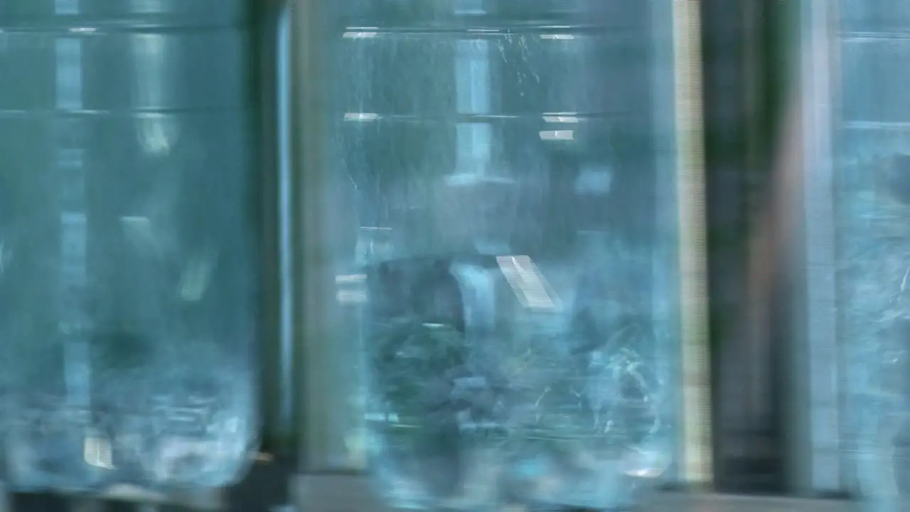 New plastic bottles on the conveyor belt of a drinking water plant