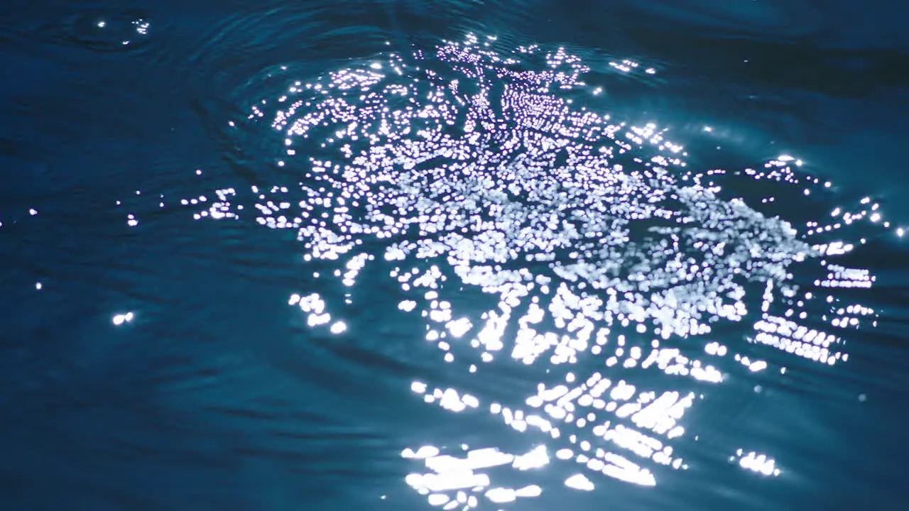 Blue Water With Small Waves And Ripples In Slow Motion