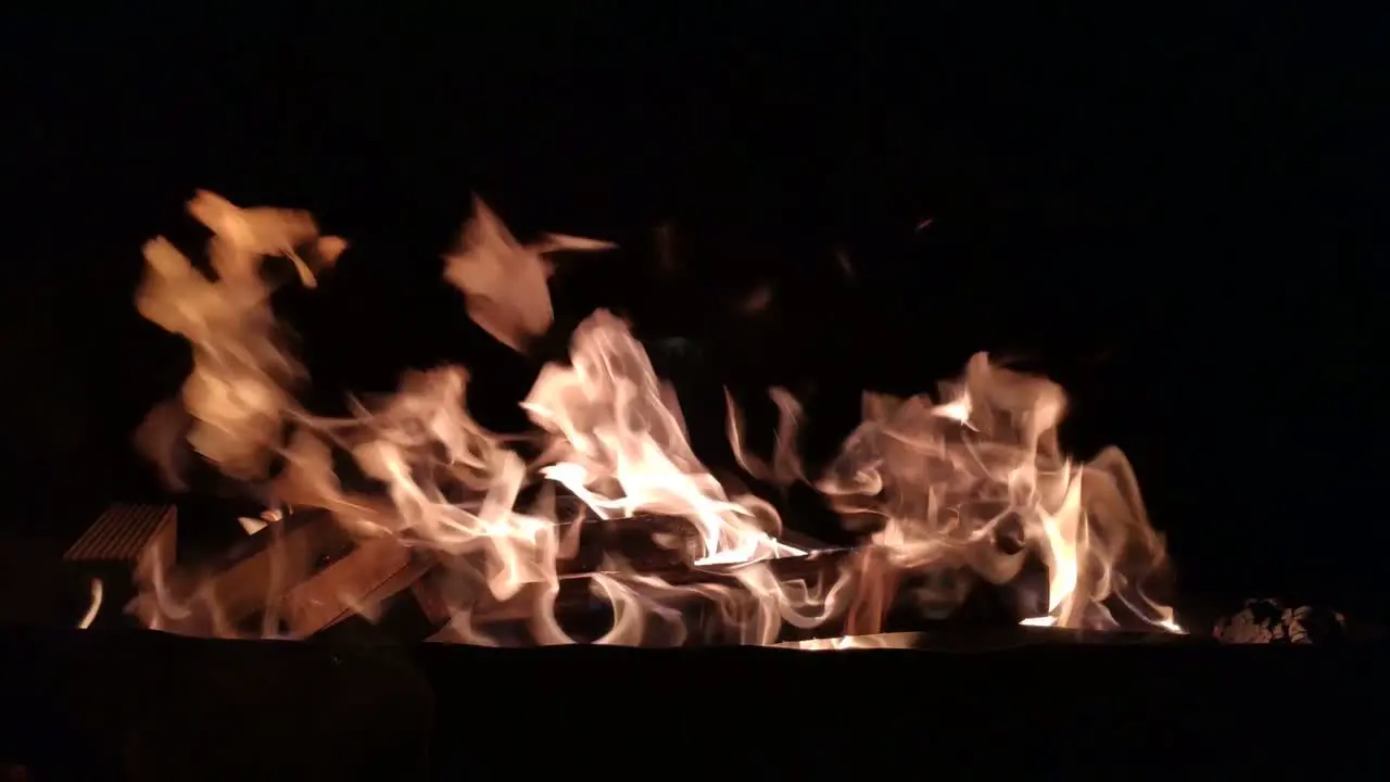 blacksmith forge with strong fire flames produced with charcoal fuel and wood in the dark of night shot blocked close-up Galicia Spain