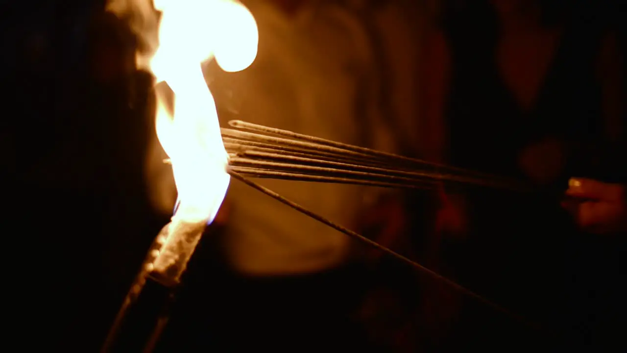 Multiple sparklers getting lit together