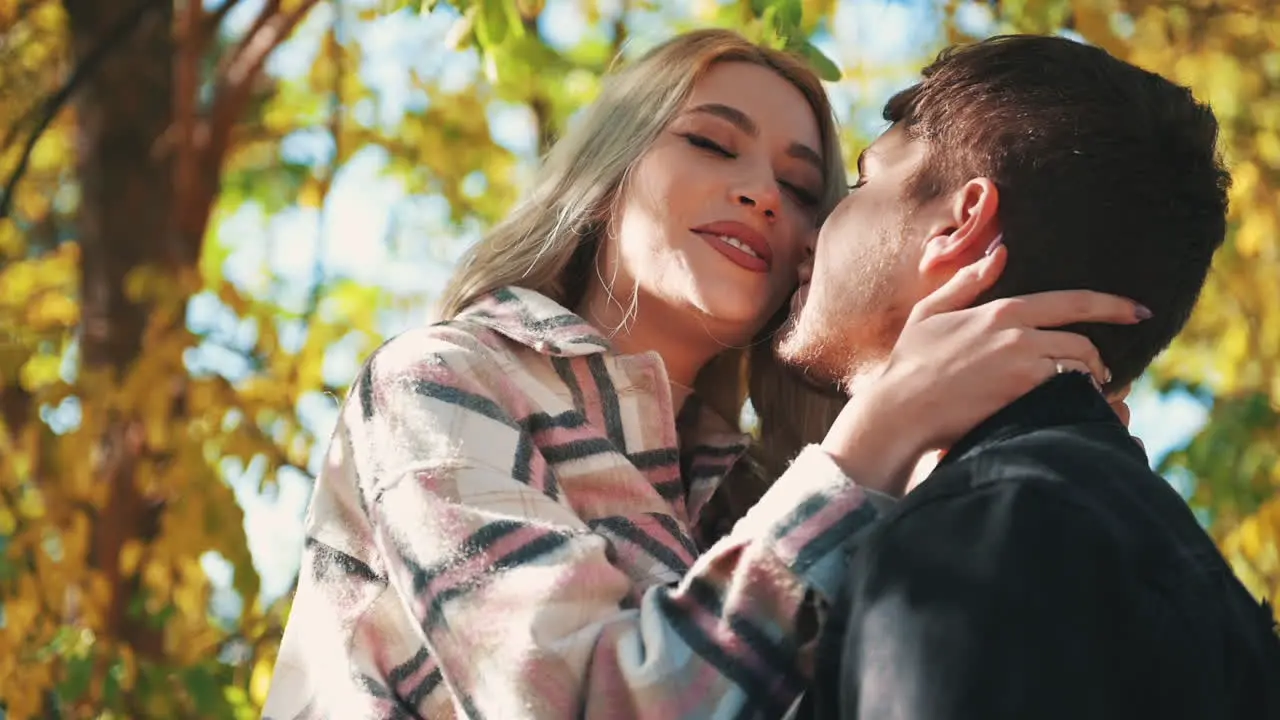 Portrait Of Pretty Young Blonde Woman In Makeup With Lipstick Looking At Boyfriend In The Forest