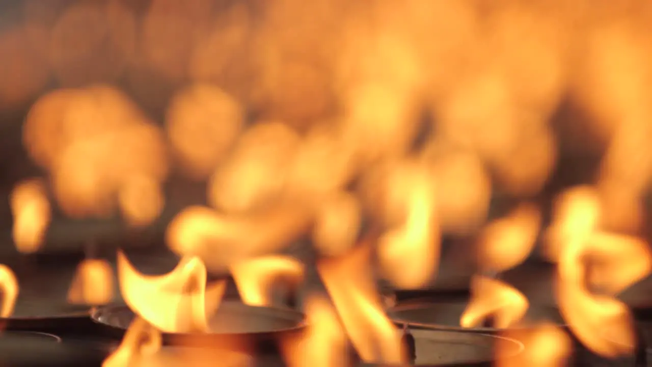 Beautiful prayer candles burn at a Buddhist temple