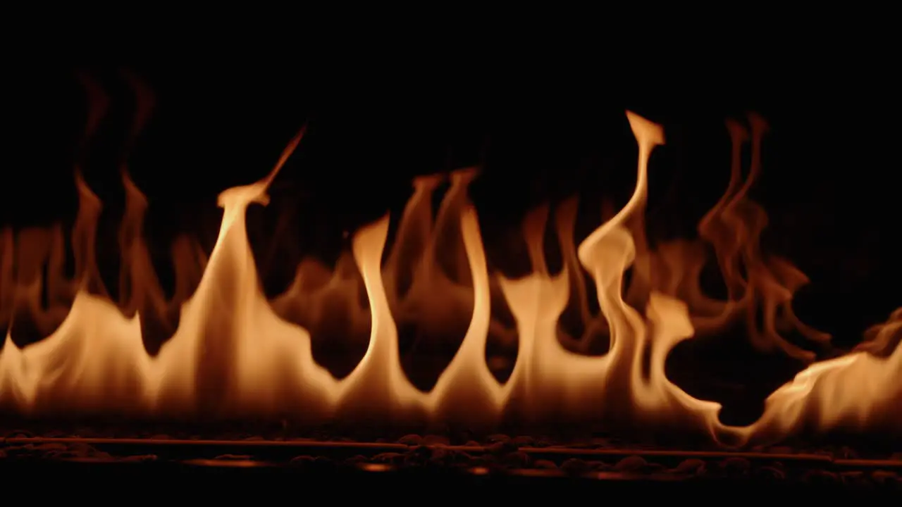 Slow-Motion gas-powered flames flicker from a luxury gas fire place