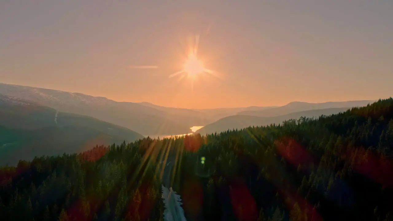 Drone moving over Lysefjord surrounded by rocky mountains in Norway during evening time