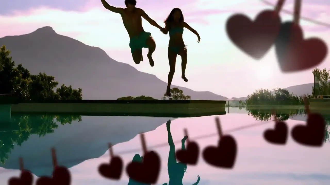 Happy couple jumping in a lake and hearts for valentine day