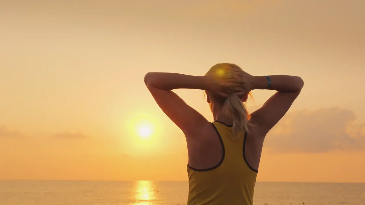 Fitness Woman Admiring The Sunrise Over The Sea Freshness Beauty And Health Concept