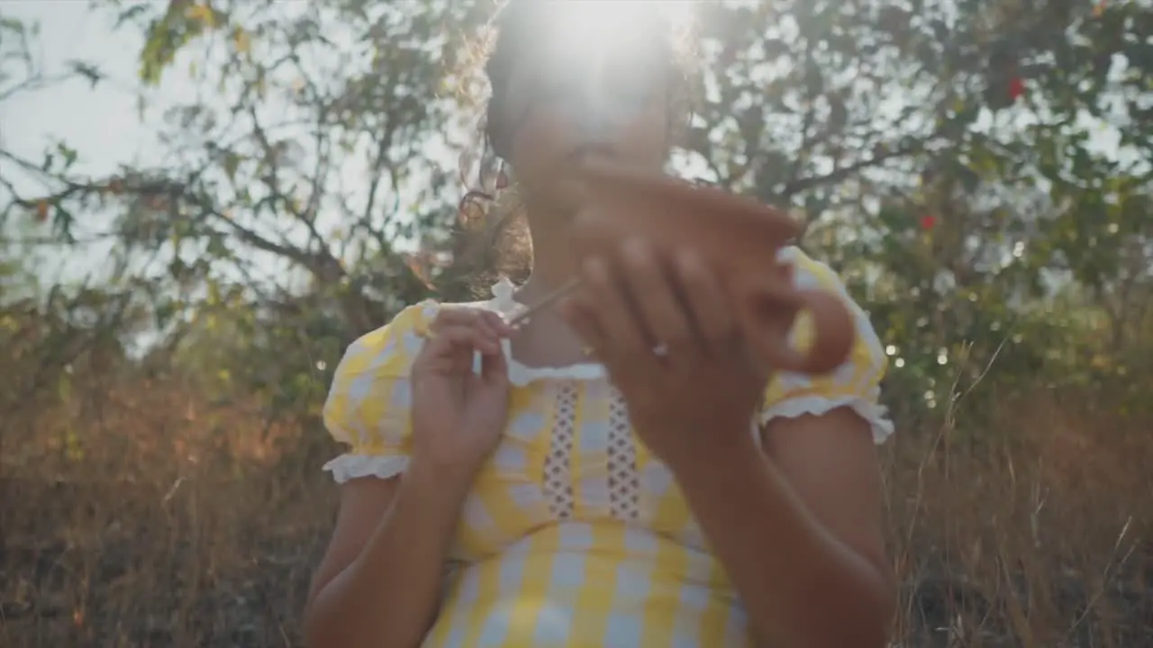 moment of creativity and focus as the young woman works with her hands surrounded by nature