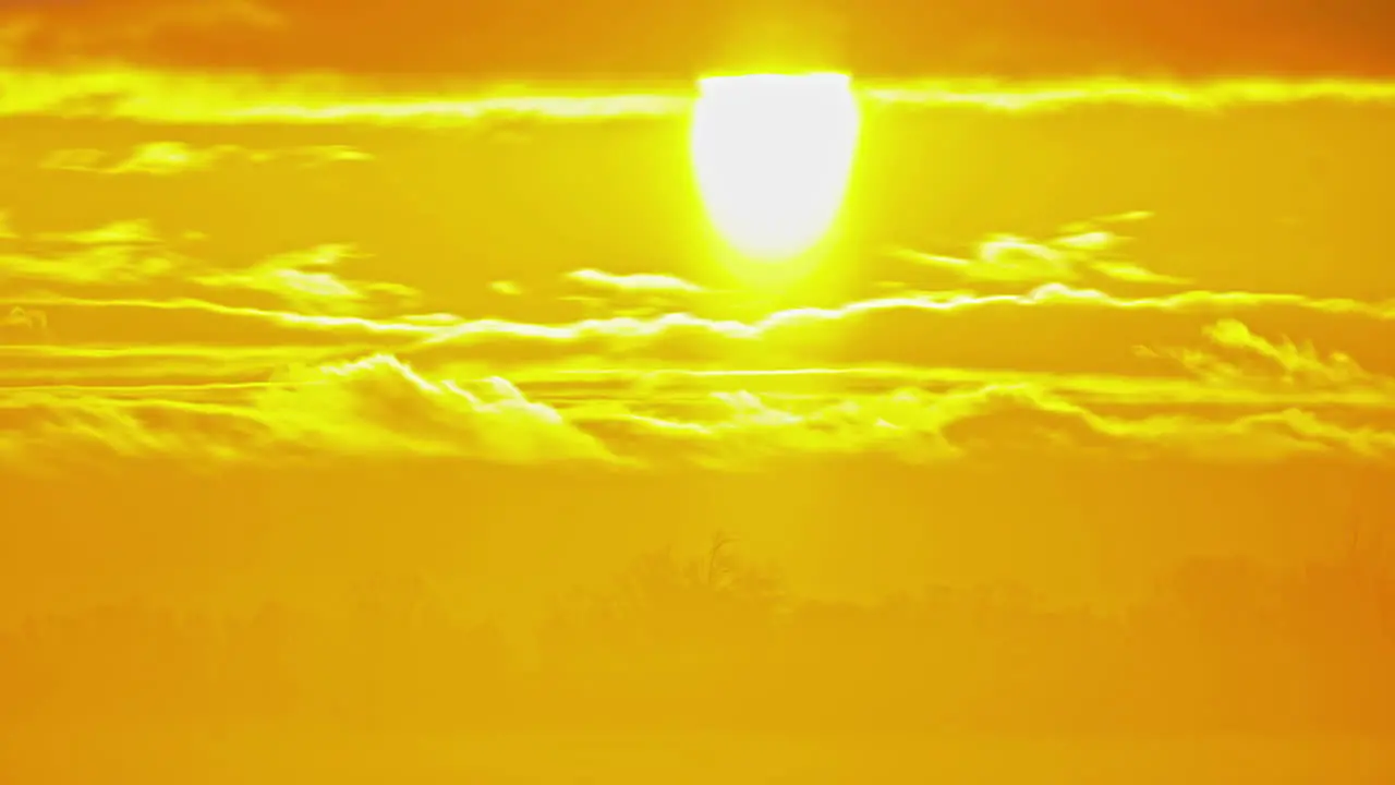 Bright Sunlight On Golden Horizon During Sunrise Timelapse