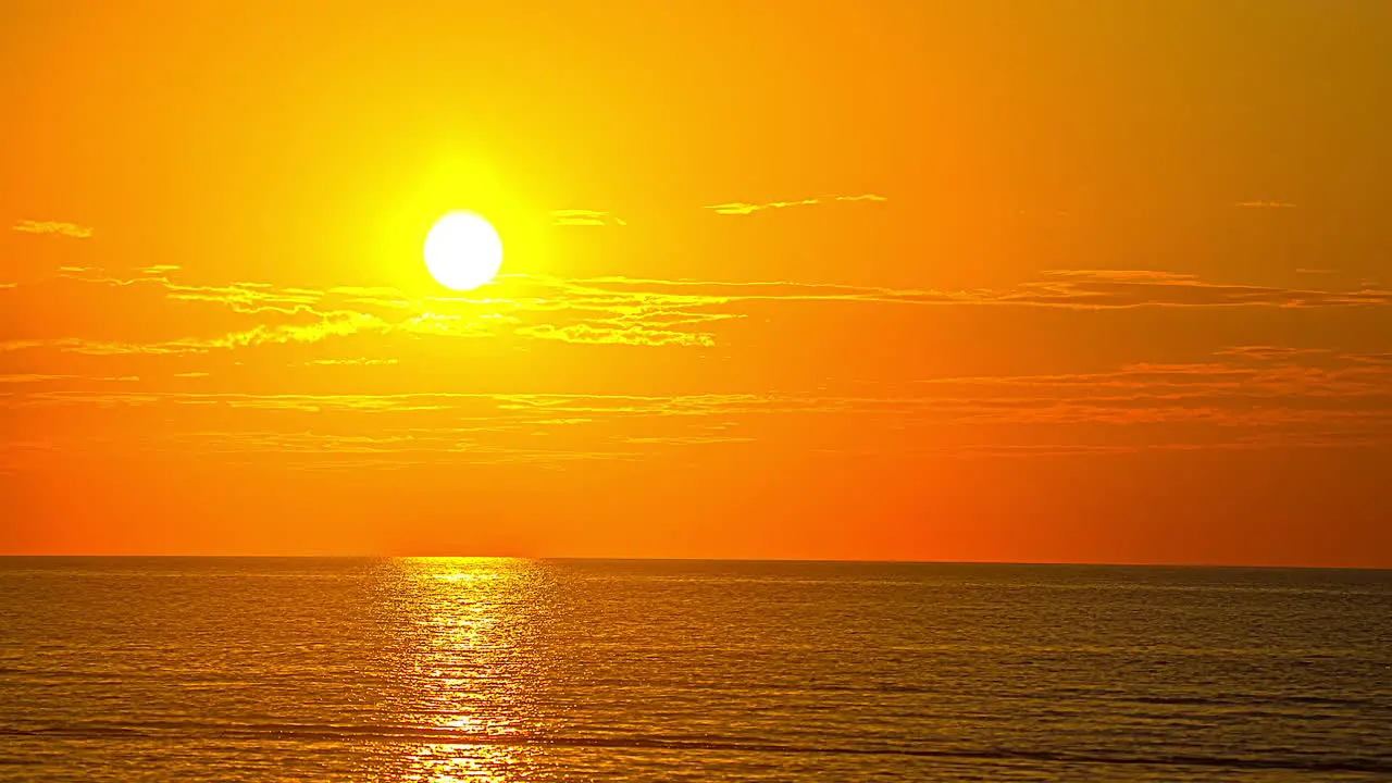 Romantic Golden Sunset Sky Over Calm Ocean Waters