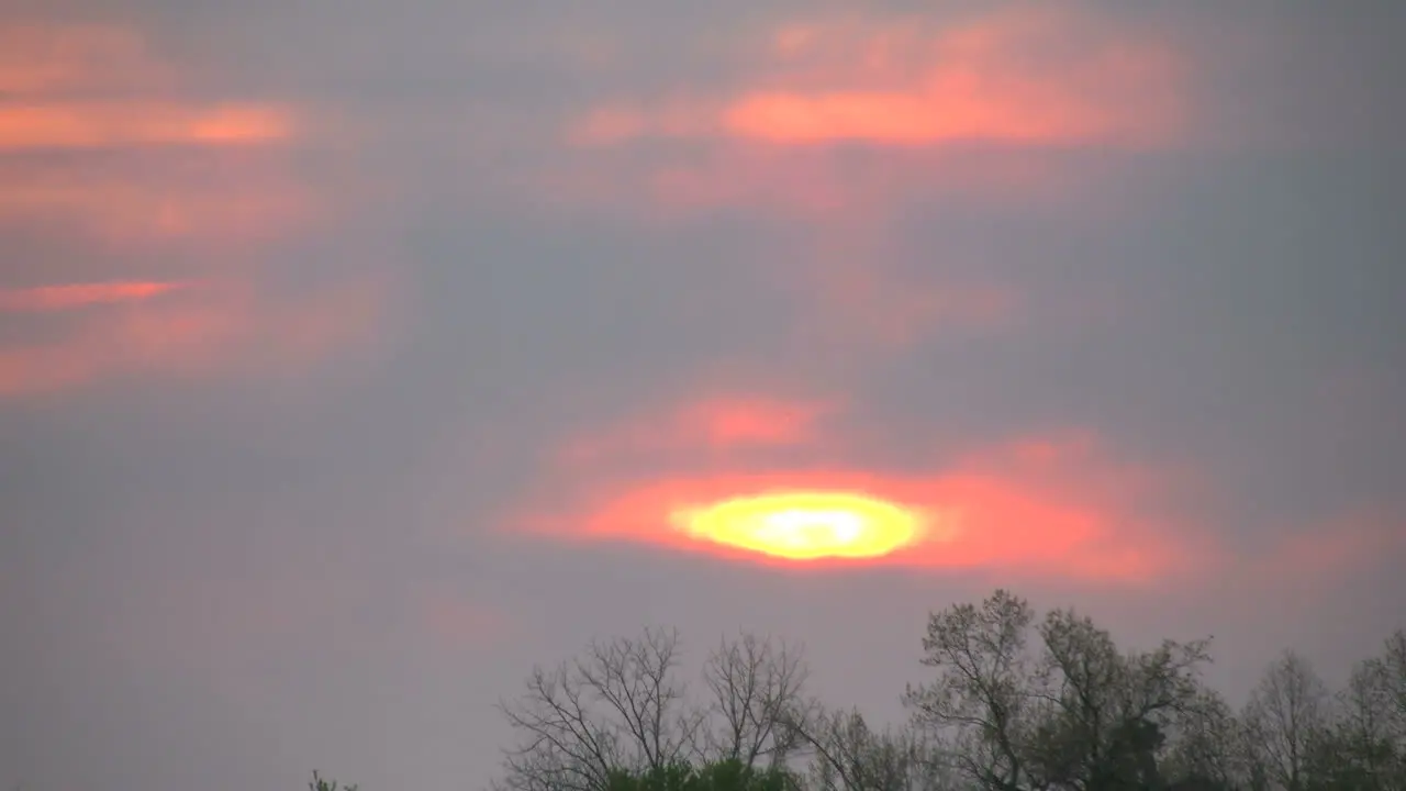 Sun Setting Through Clouds