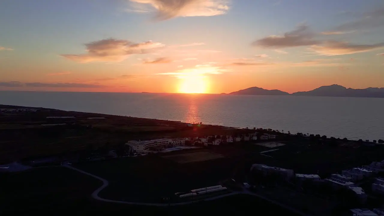 Cinematic aerial shot of a beautiful sunset in Greece