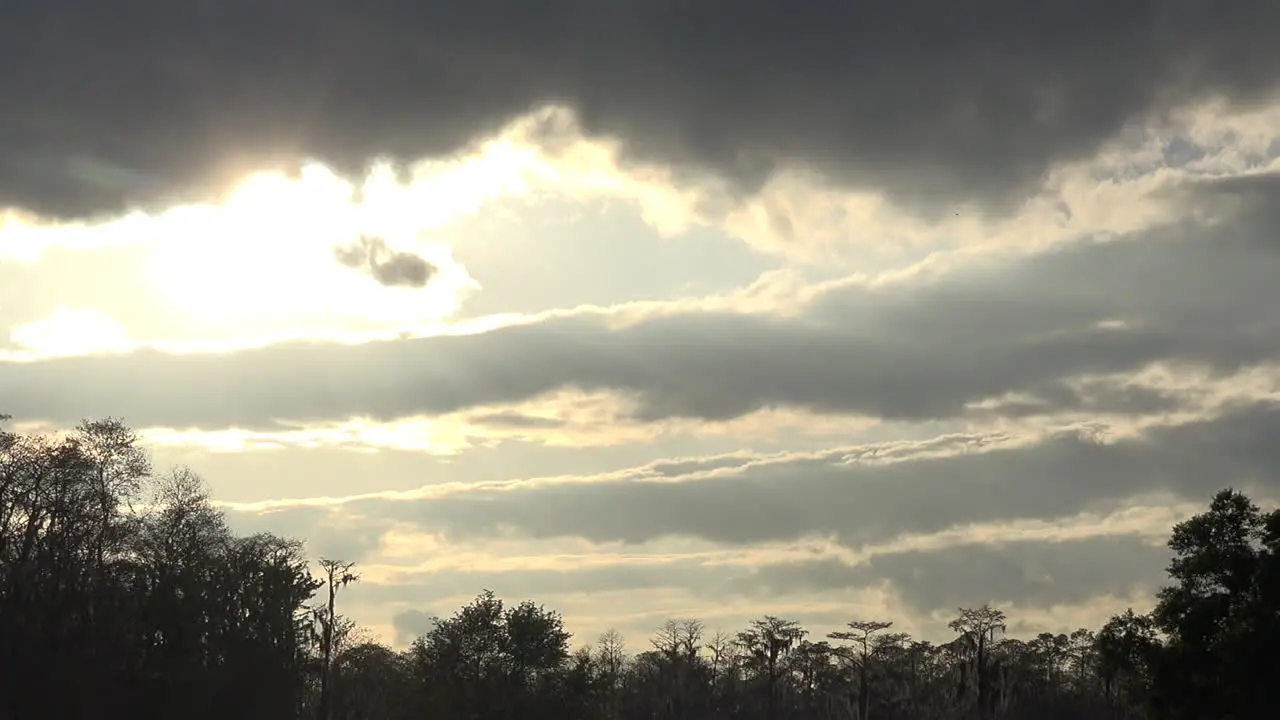 Georgia Okefenokee Sun Behind Clouds And Water Tilt Down