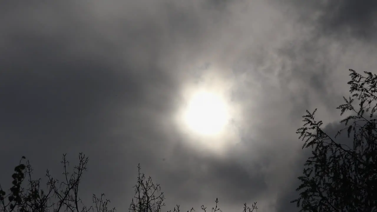 Grey clouds over sun time lapse