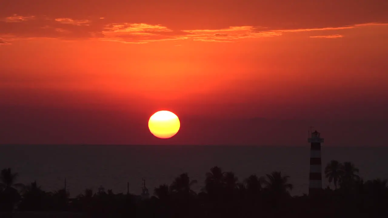 Mexico setting sun with lighthouse