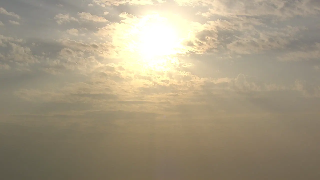 Sunbeams shining through the clouds over sea