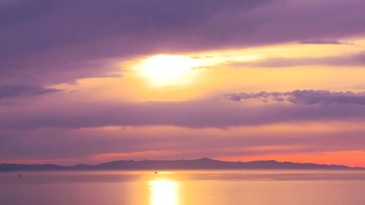 Time lapse of the sun setting as clouds roll in