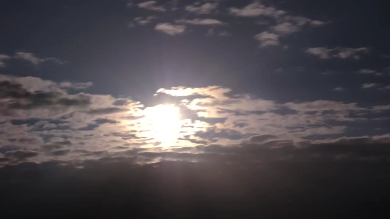 Shining sun and sunbeams through clouds Timelapse