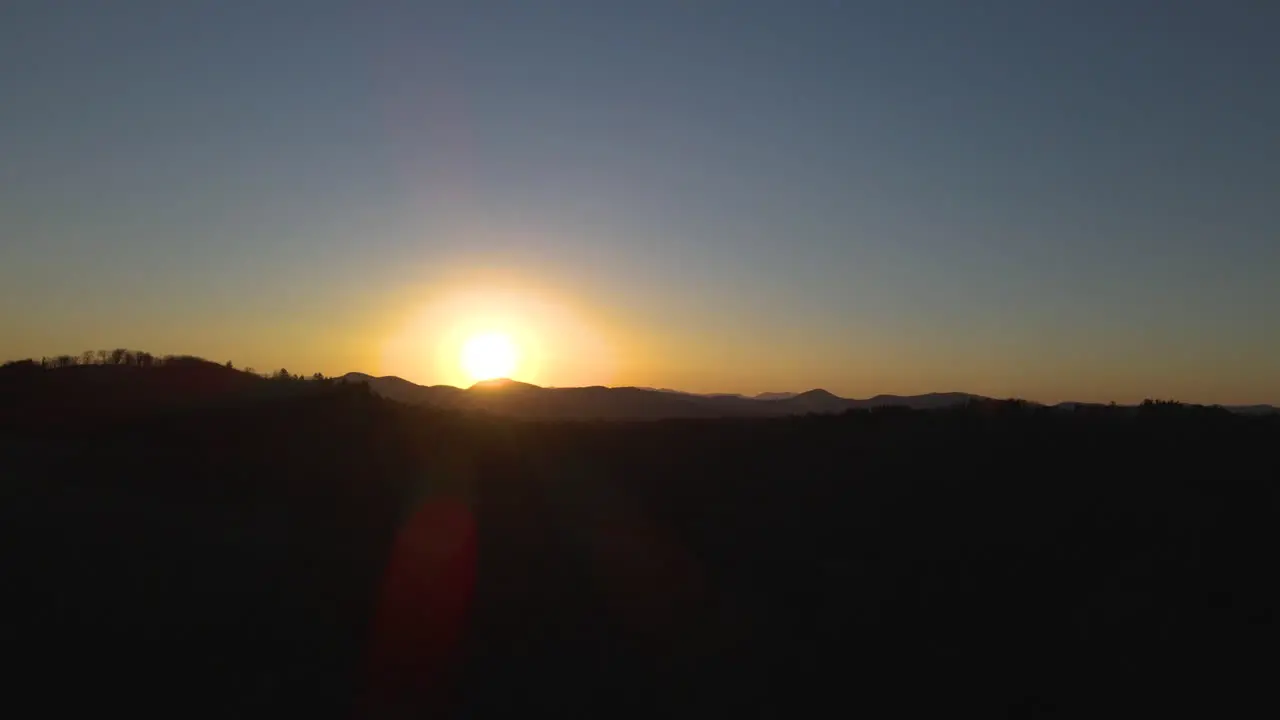 Cinematic drone shot of sun setting in the Blue Ridge Mountains