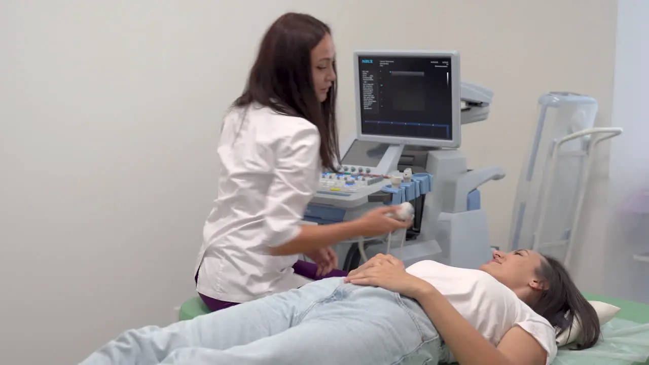 Patient Lying On Hospital Gurney Female Doctor Does Ultrasound