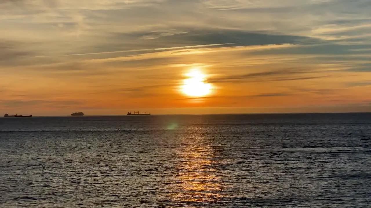 Loop of Scenic sunset over beach wide