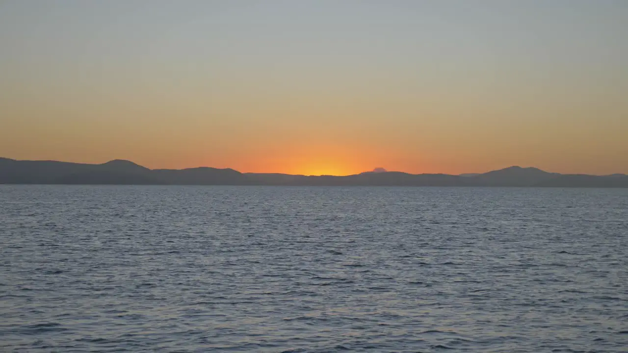 Beautiful bright sunset beyond the mountains of Queensland Australia -Wide